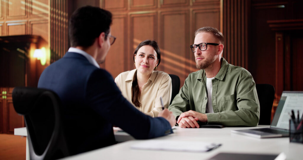 Divorce Lawyer Consulting Couple In Court Meeting
